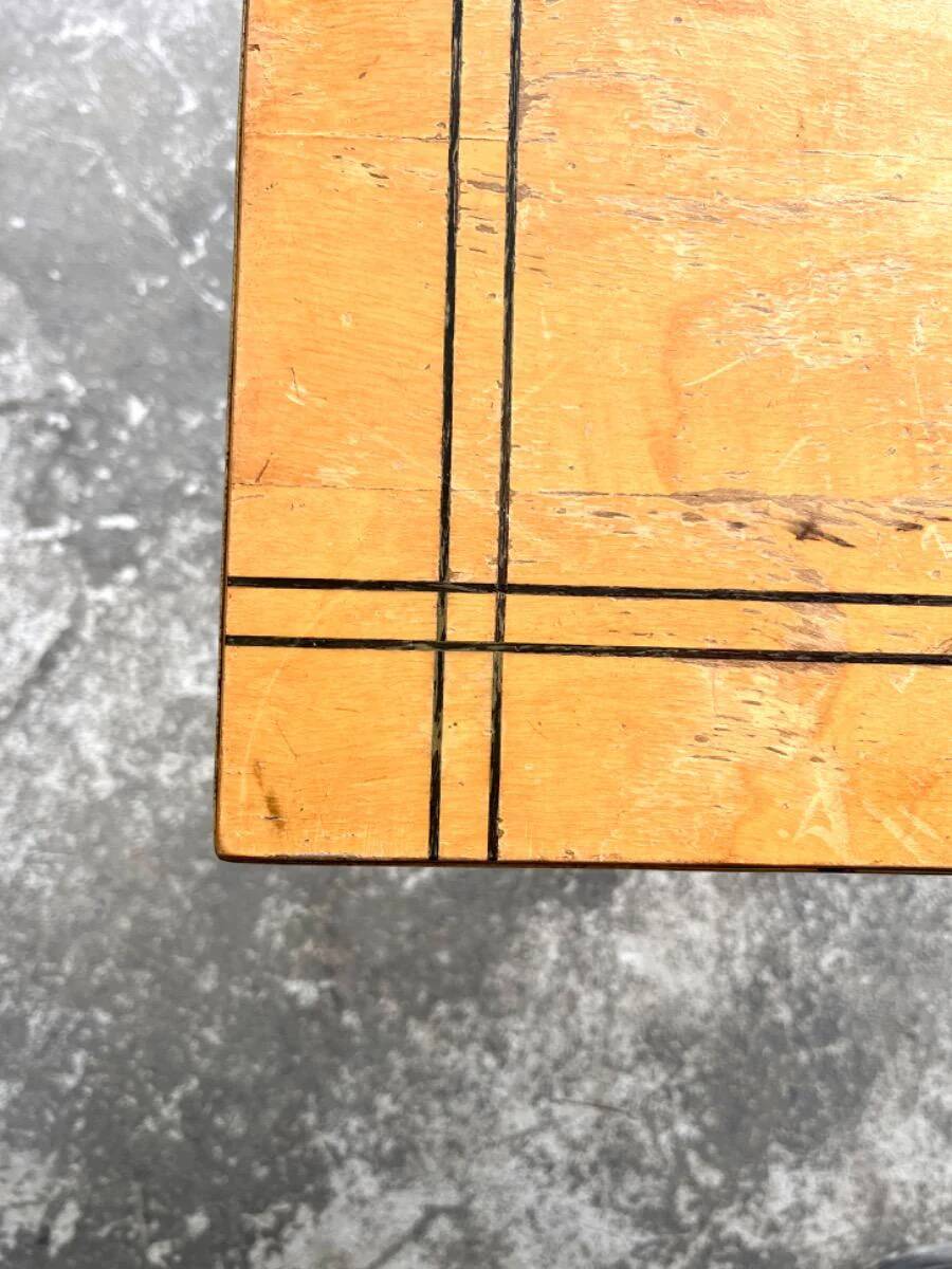 Vintage coffee table with gold-gilded legs and light brown wood veneer geometric inlaid top