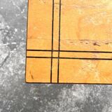 Vintage coffee table with gold-gilded legs and light brown wood veneer geometric inlaid top