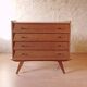 Vintage slanted commode with tapered legs from the 1960s in golden oak.