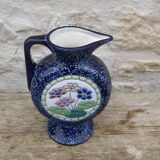 Blue ceramic vase with floral motifs