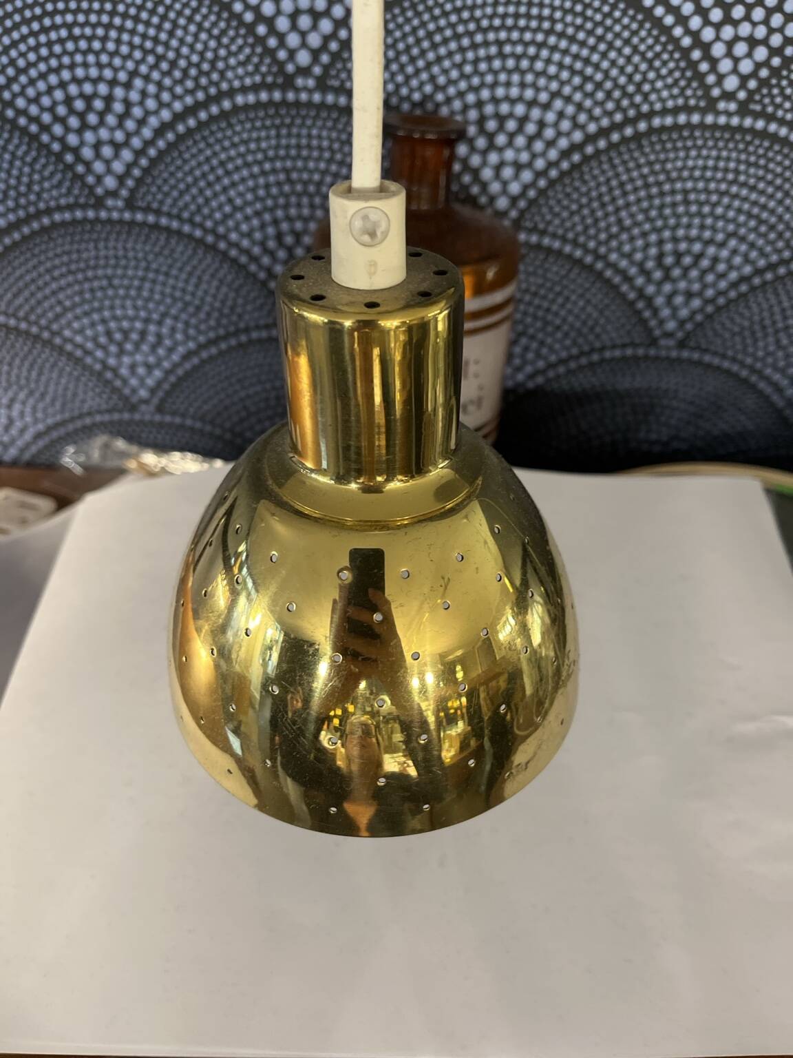 Pair of vintage 1970s gold perforated metal pendant lights. 6 lots.