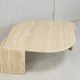 Table basse de forme courbe, travertin, France, circa 1970.