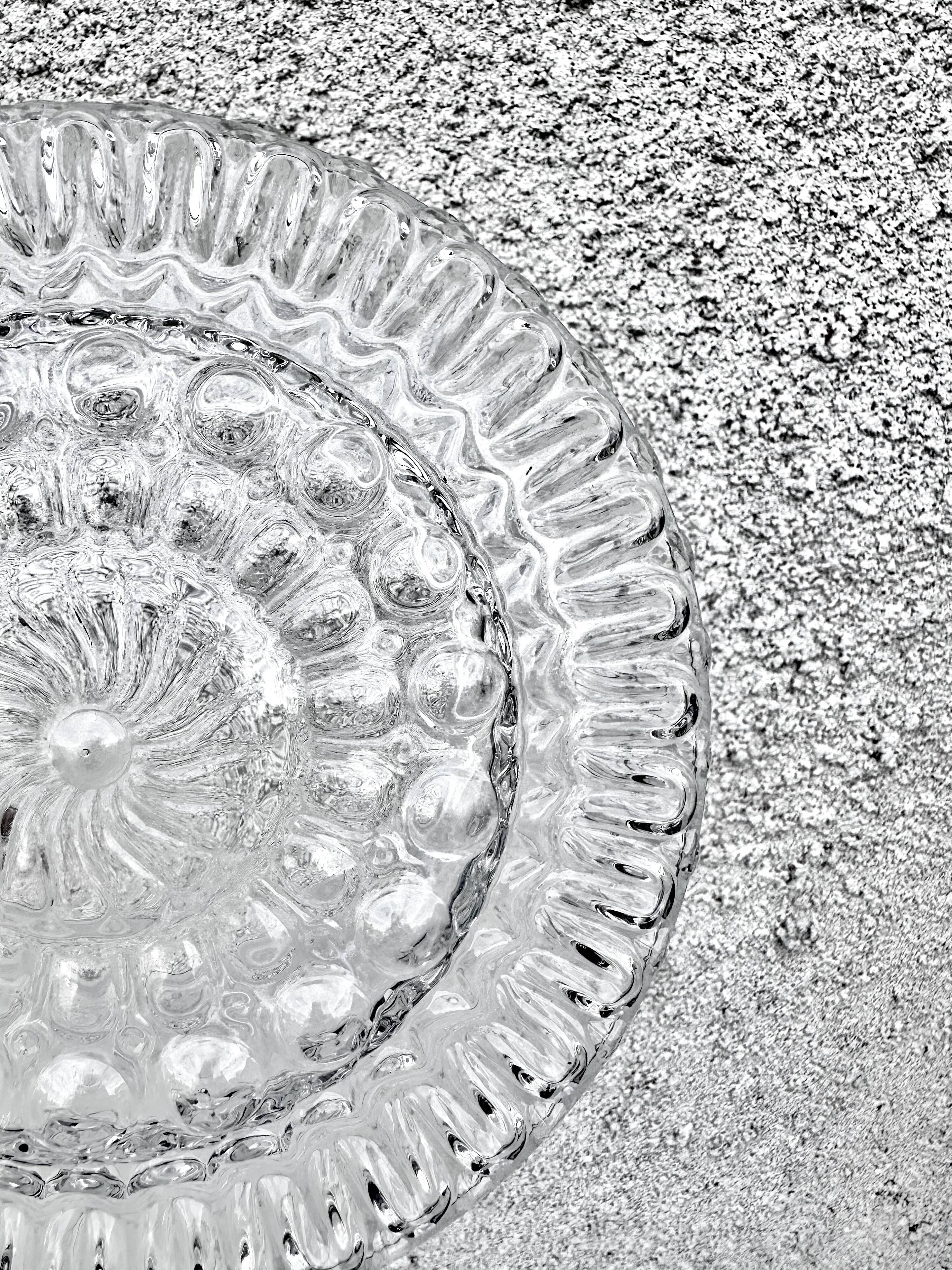 Set of three round wall/ceiling lights in moulded glass.