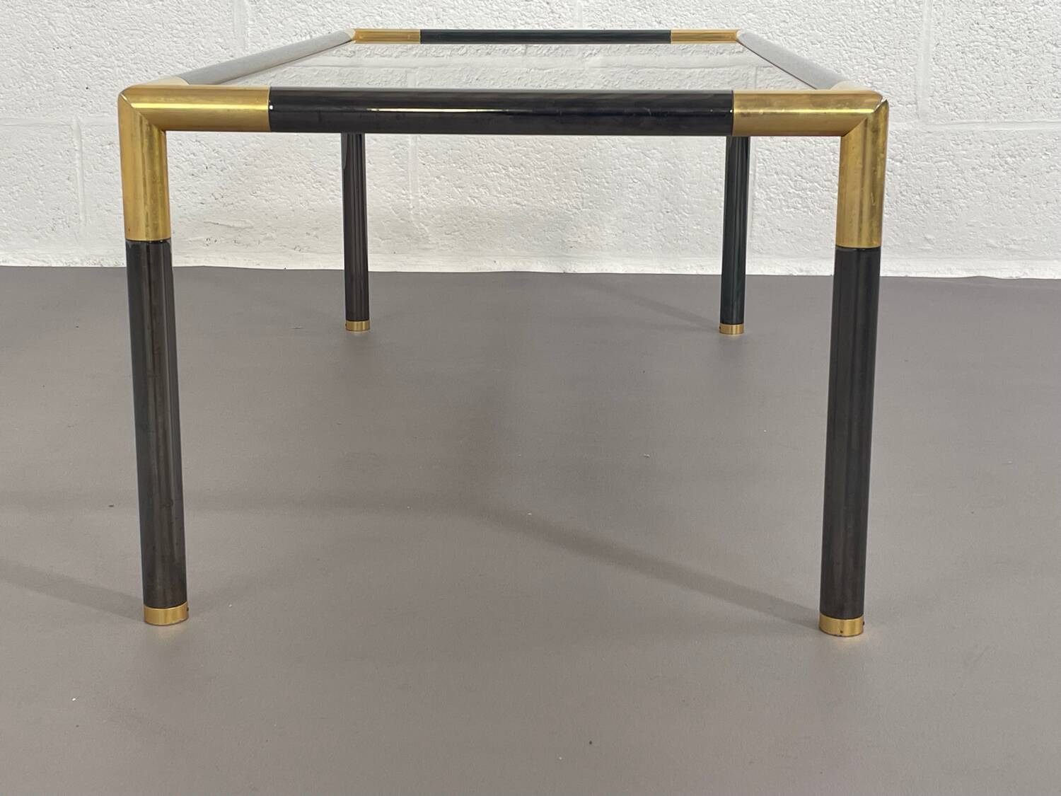 Gunmetal gold metal and smoked glass coffee table from the 70s