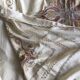 Grey silk nape and towels embroidered with coloured cashmere patterns