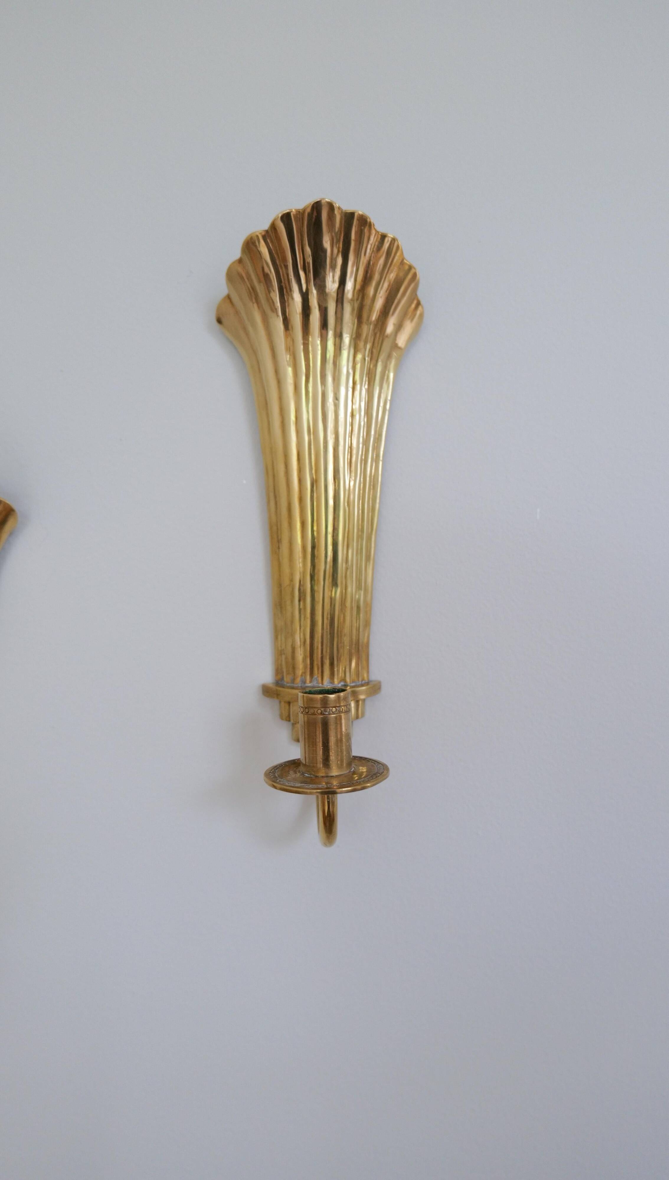 Pair of Art Deco brass wall sconces by Holmström, Arvika, Sweden, 1940s.