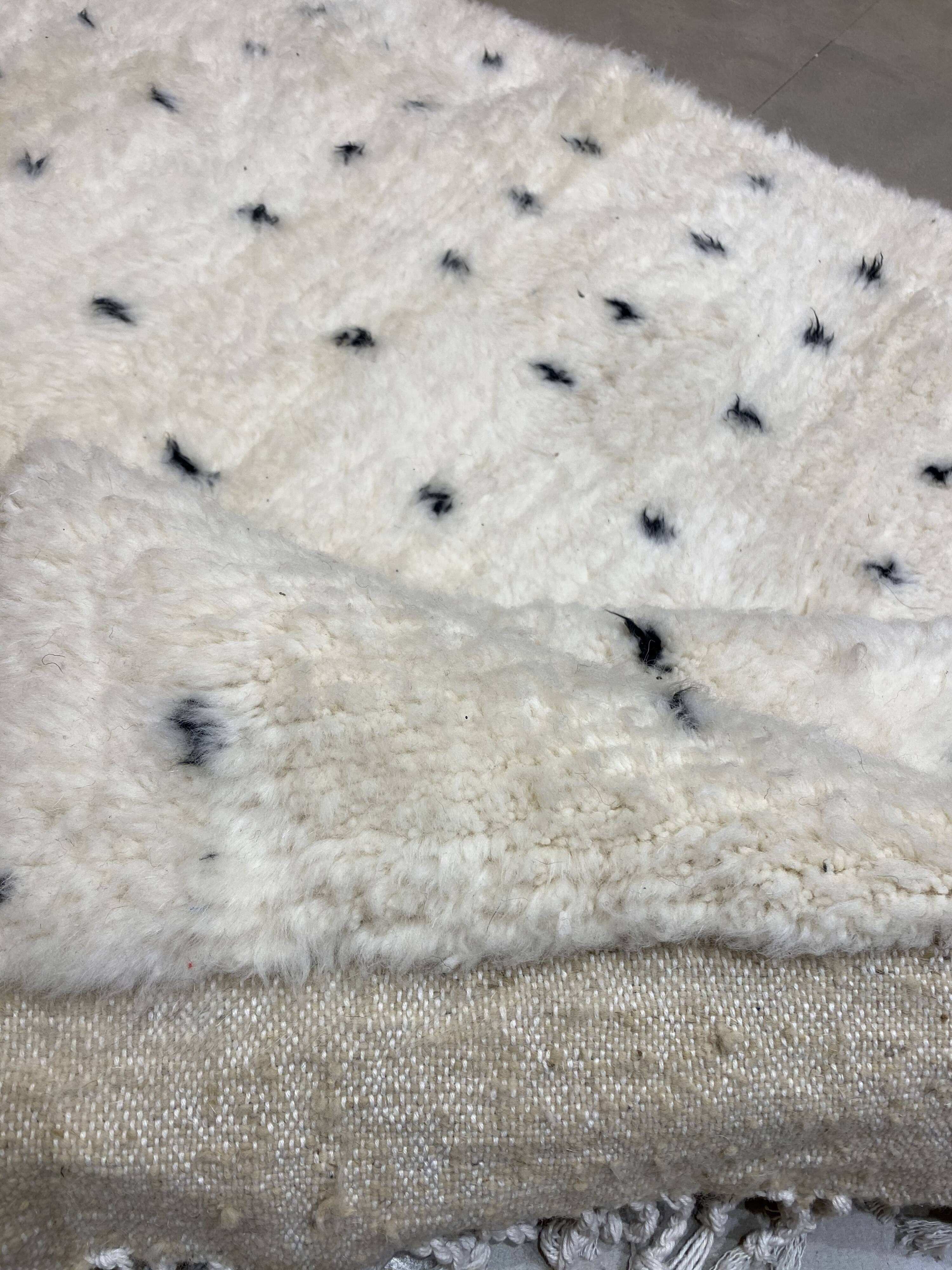 White wool mat with stitches