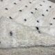 White wool mat with stitches