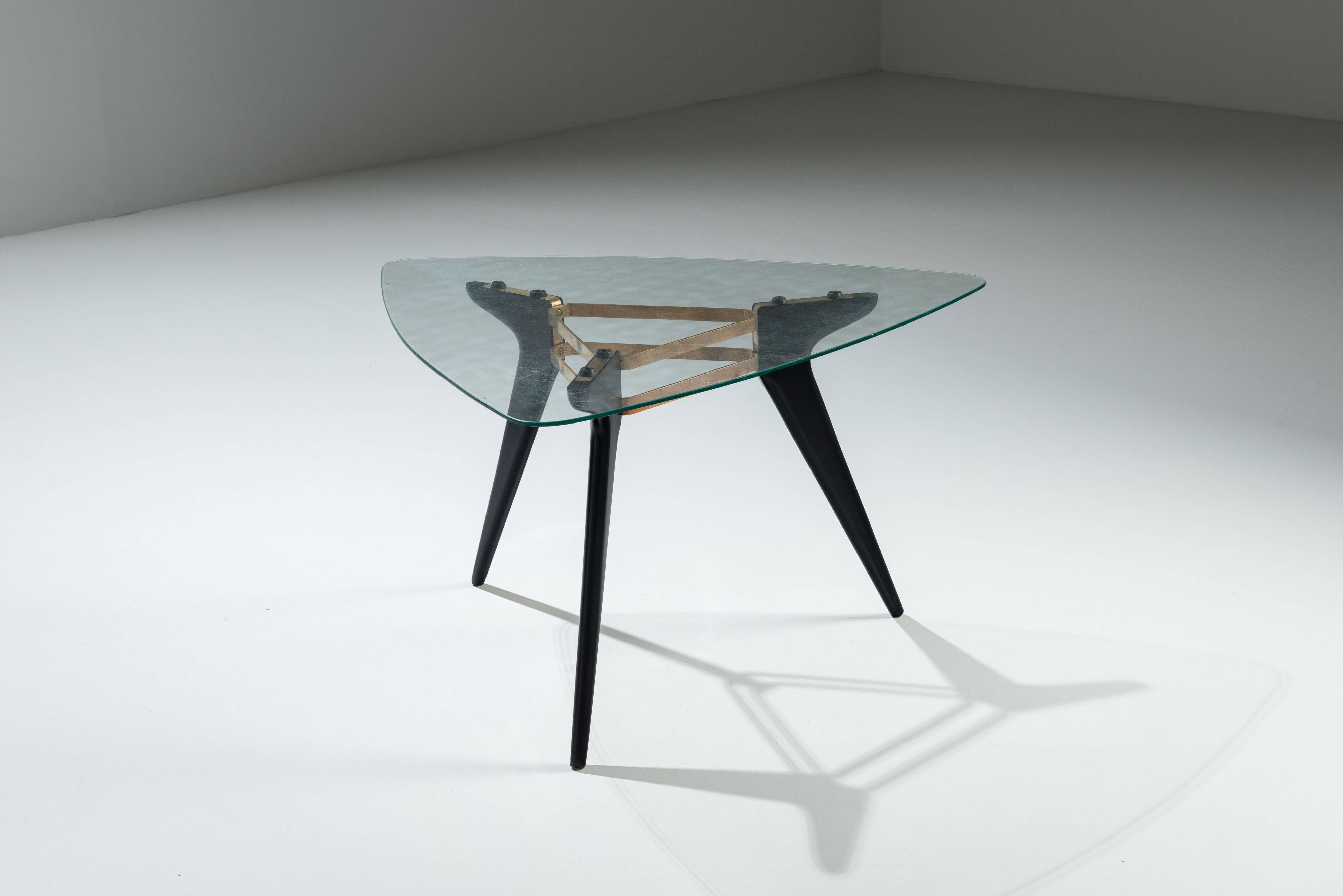 Triangular coffee table in the manner of Alfred Hendrickx