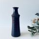 Tubular vase in glazed brown sandstone