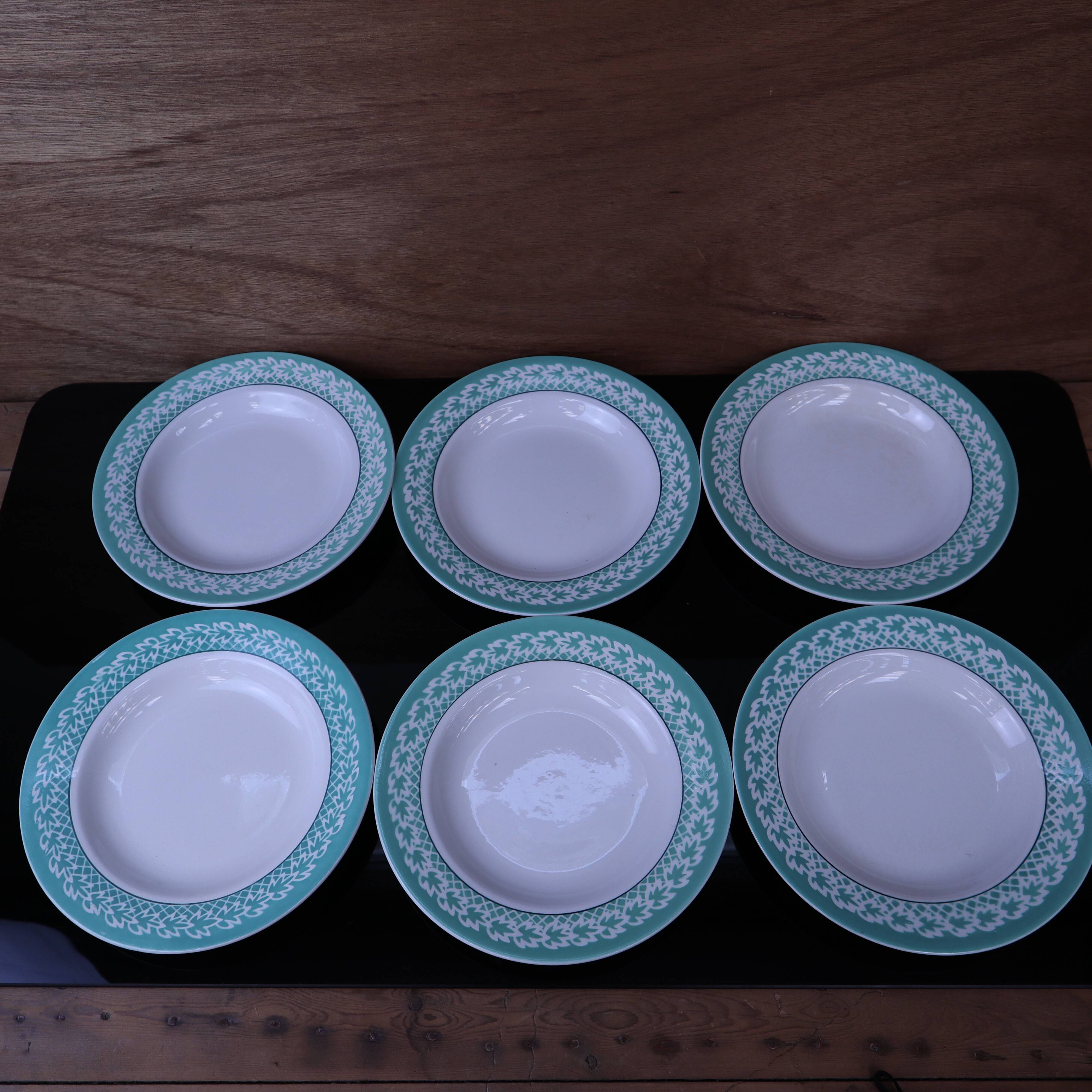 Set of 6 KIFO L'Amandinoise deep plates with green leaf design.