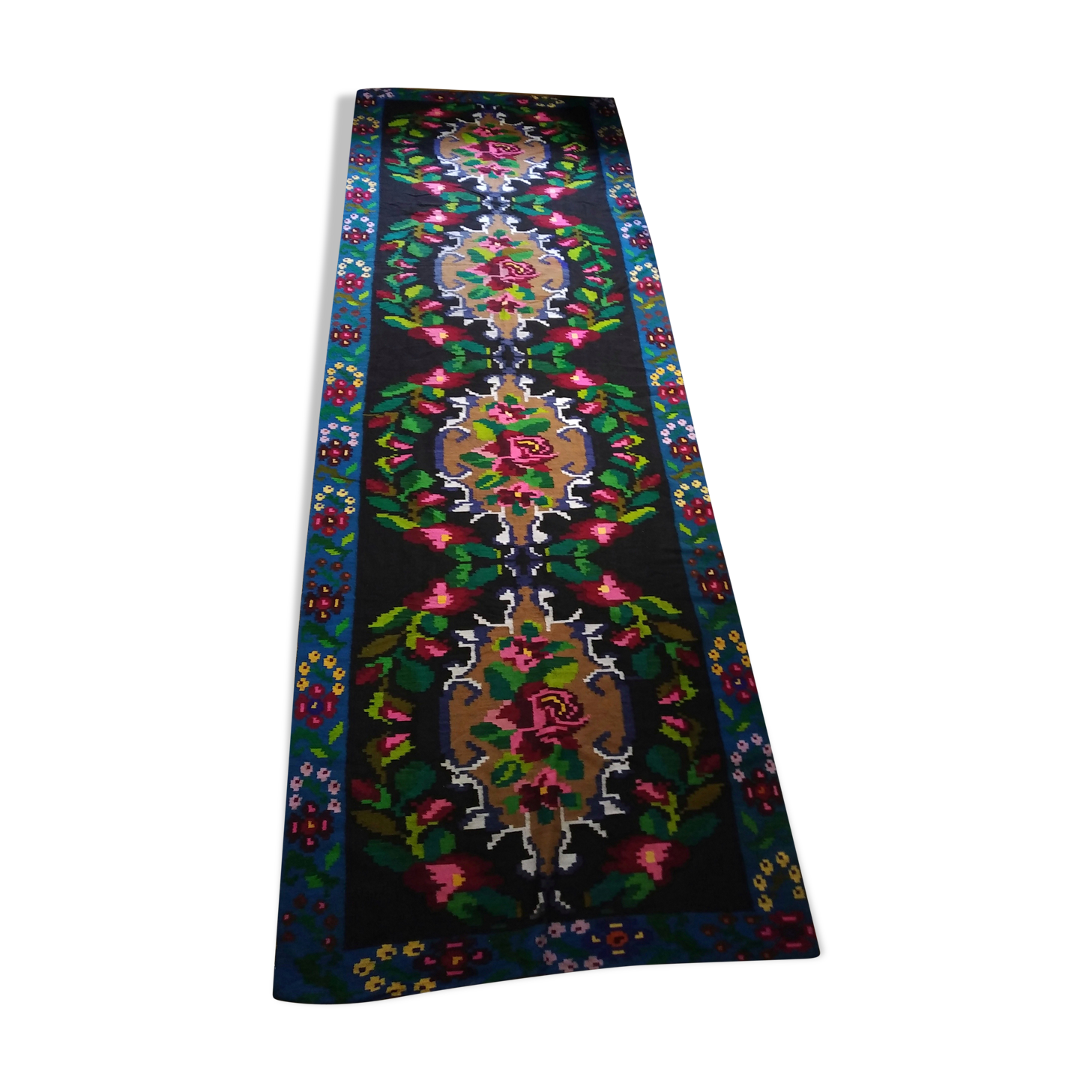 Romanian floral runner rug on blue background