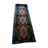 Romanian floral runner rug on blue background