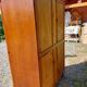 Armoire aux pieds compas