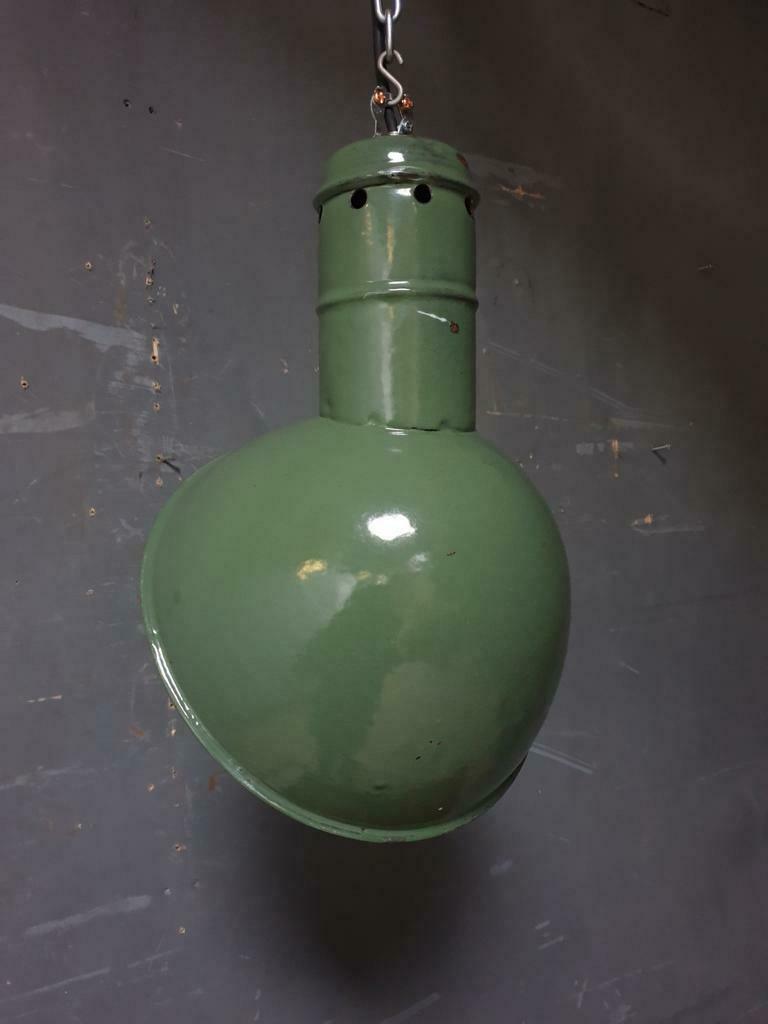 Old industrial enamel lamp in green