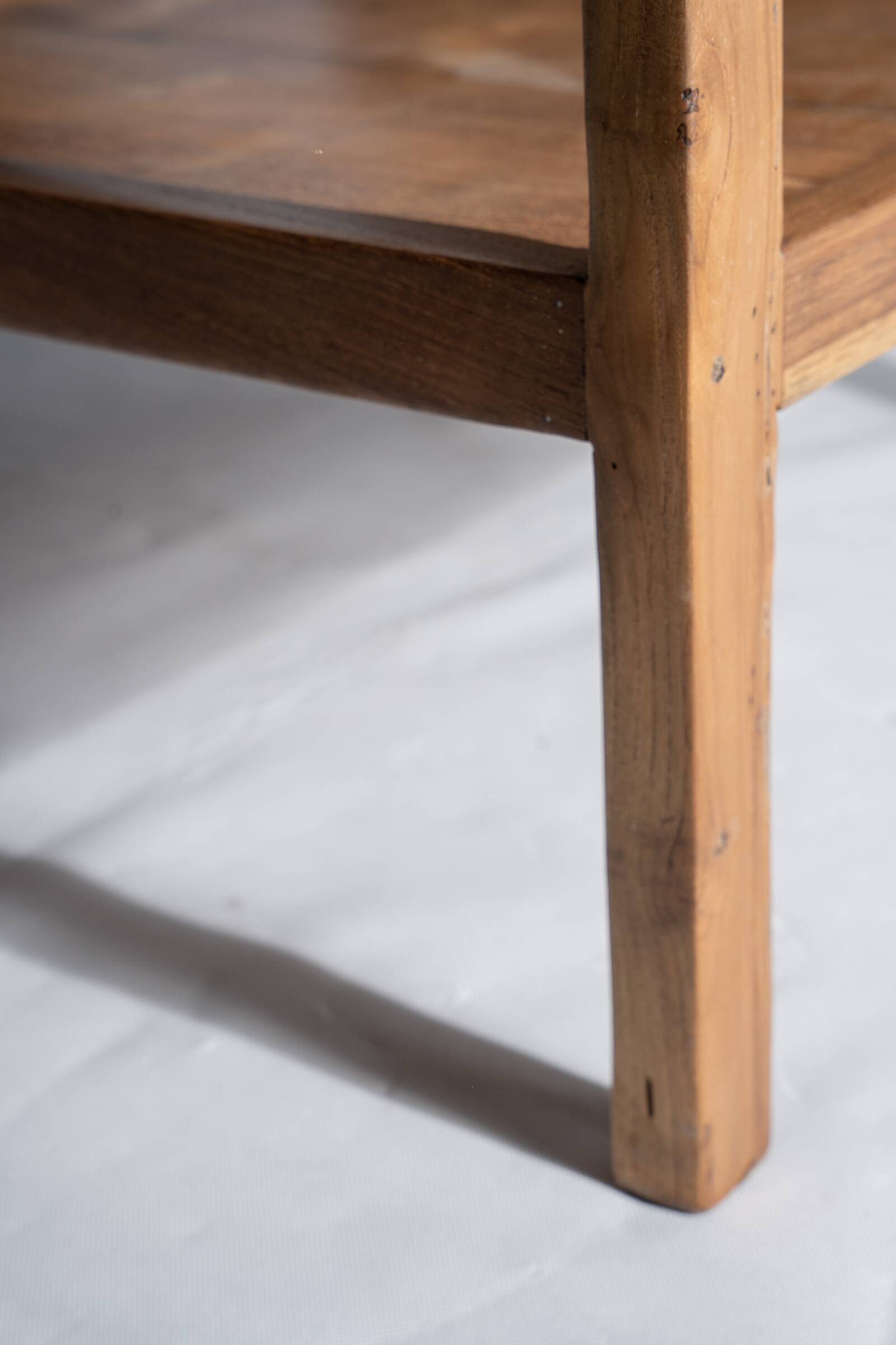 Large armchair in natural wood (teak) with a minimalist design.