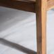Large armchair in natural wood (teak) with a minimalist design.