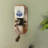Old wall-mounted coffee grinder