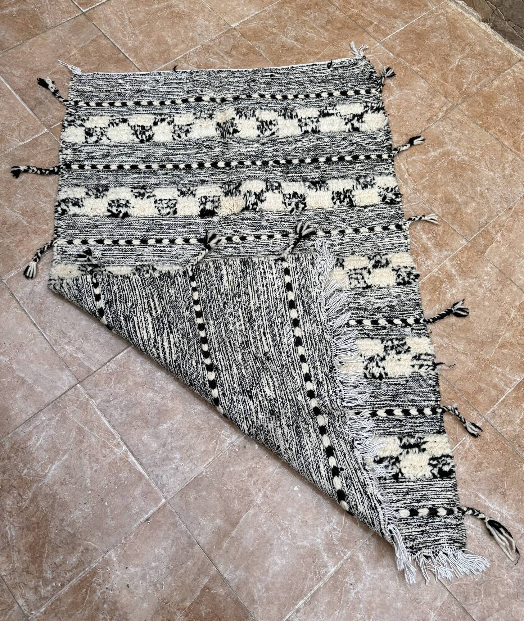 Small black Moroccan Berber Zanafi kilim rug for bedroom and living room.