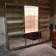 Ivory-colored and matte gold anodized aluminum display bookcase