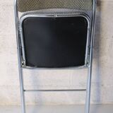 Vintage folding chair in chrome metal and chevron fabric.