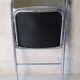 Vintage folding chair in chrome metal and chevron fabric.
