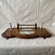 Art Deco wooden wall coat rack with round central mirror
