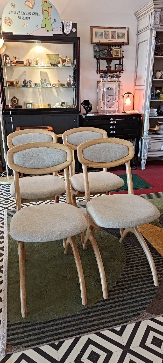Four Scandinavian-style chairs
