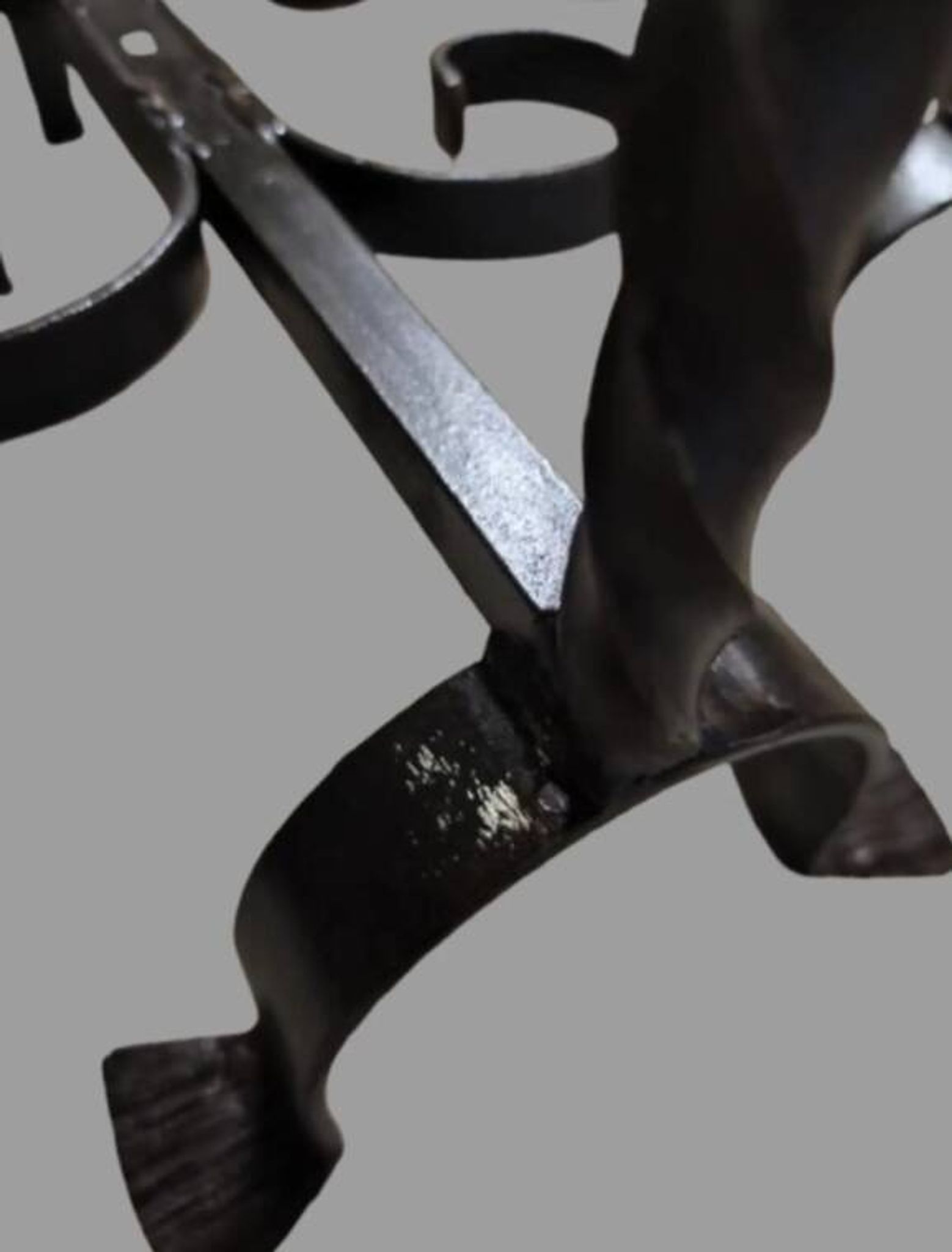 Pair of wrought iron candlesticks with cast bronze ball, 1970s.