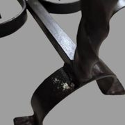 Pair of wrought iron candlesticks with cast bronze ball, 1970s.