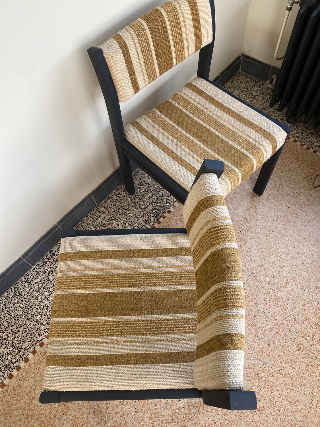 2 wooden chairs and vintage fabric