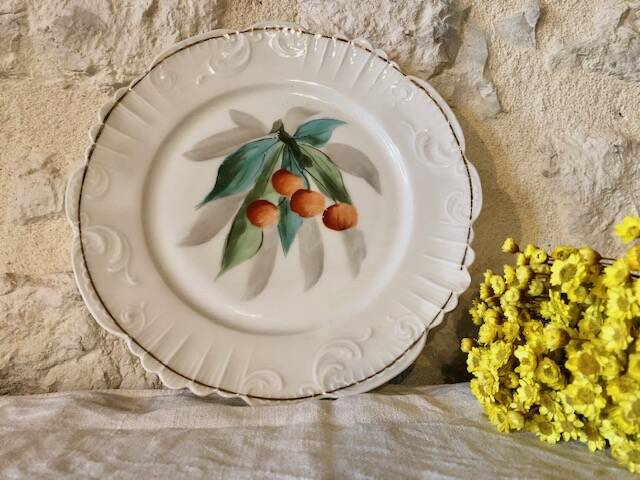 antique earthenware plate with cherries
