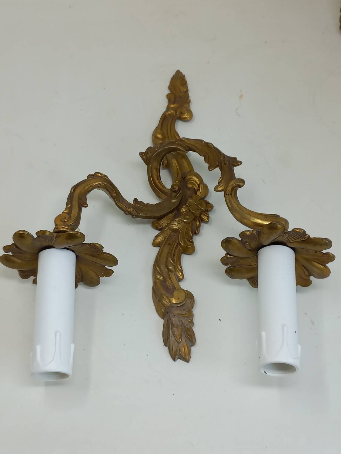 Pair of Louis XV style two-light bronze wall sconces