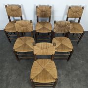 Set of 10 Bauche model chairs by Charlotte Perriand, circa 1960.