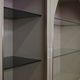 Showcases in lacquered wood, glass and brass  1970s, set of 4