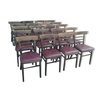 Set of 20 vintage wooden and red skai bistro chairs.