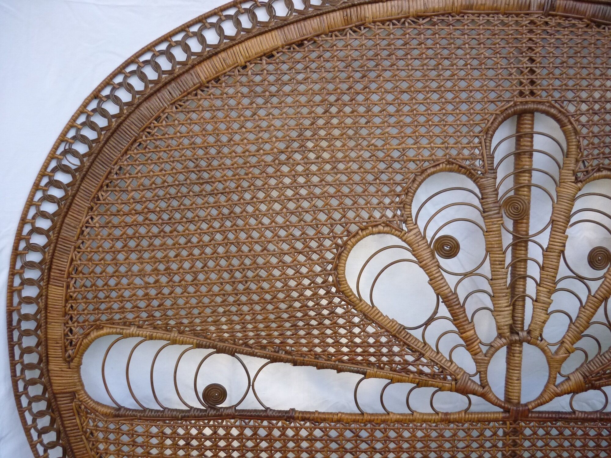 Braided and caning head of bed in wicker and rattan peacock