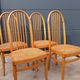 Set of 4 vintage Baumann chairs in honey wood and cane.