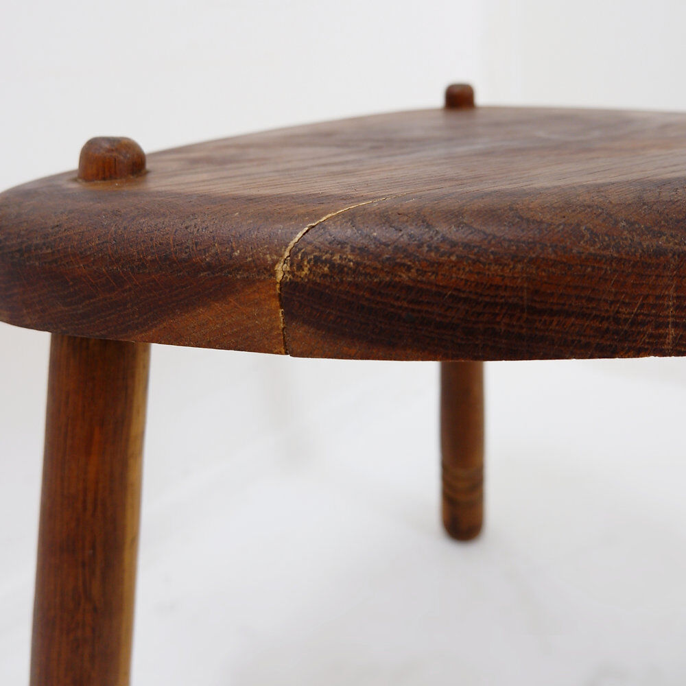 Rustic tripod stool with a triangular seat, 1960s.
