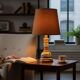 Vintage orange Portuguese table lamp with a ceramic base.