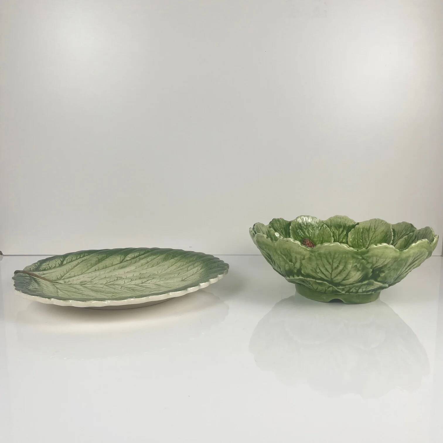 Leaf and strawberry-shaped bowl/strainer.