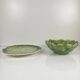 Leaf and strawberry-shaped bowl/strainer.
