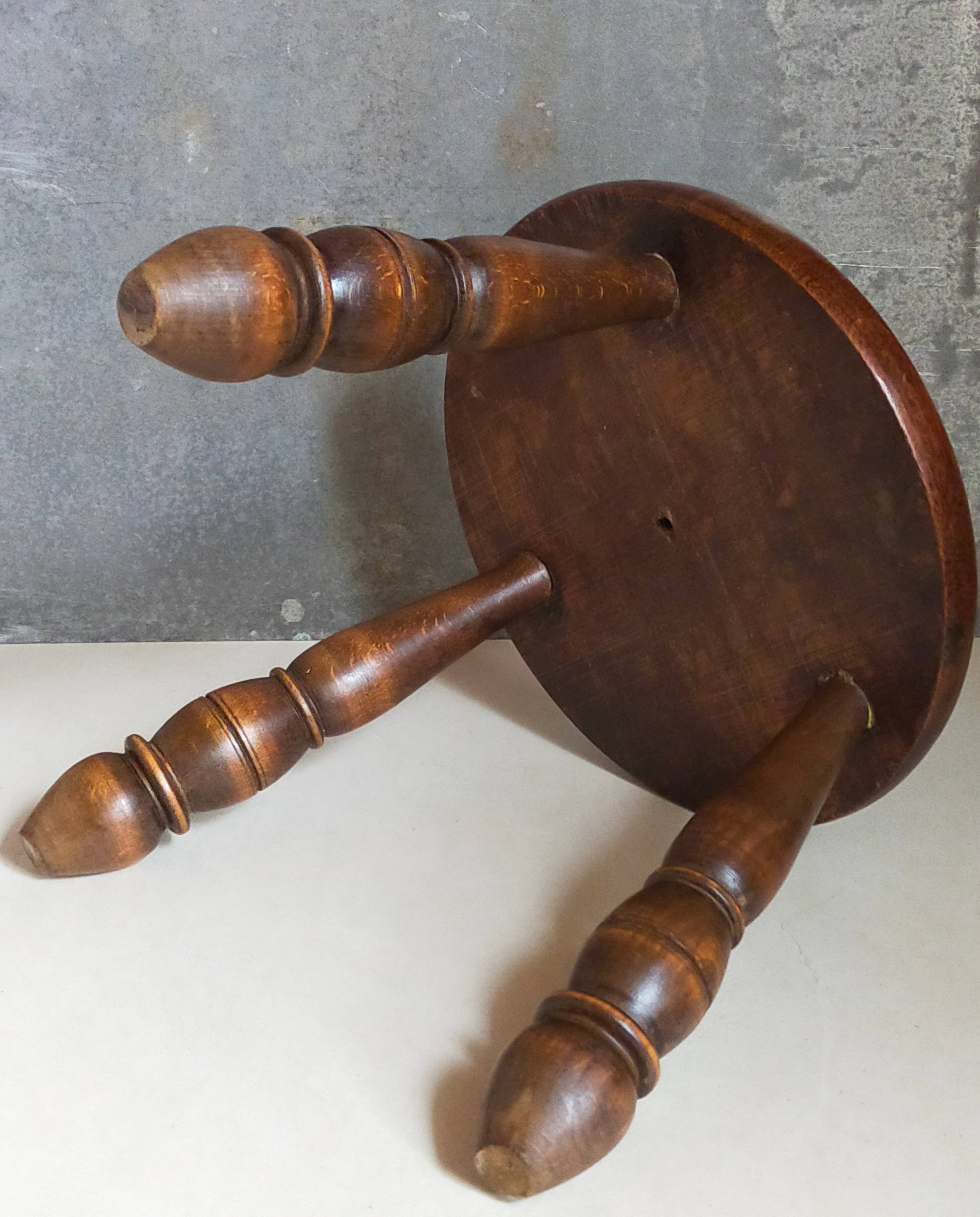 Low tripod stool in vintage turned solid wood