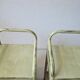 Copy of a pair of patinated metal bedside tables.