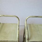 Copy of a pair of patinated metal bedside tables.