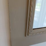 Wooden mirror with patinated beige knot