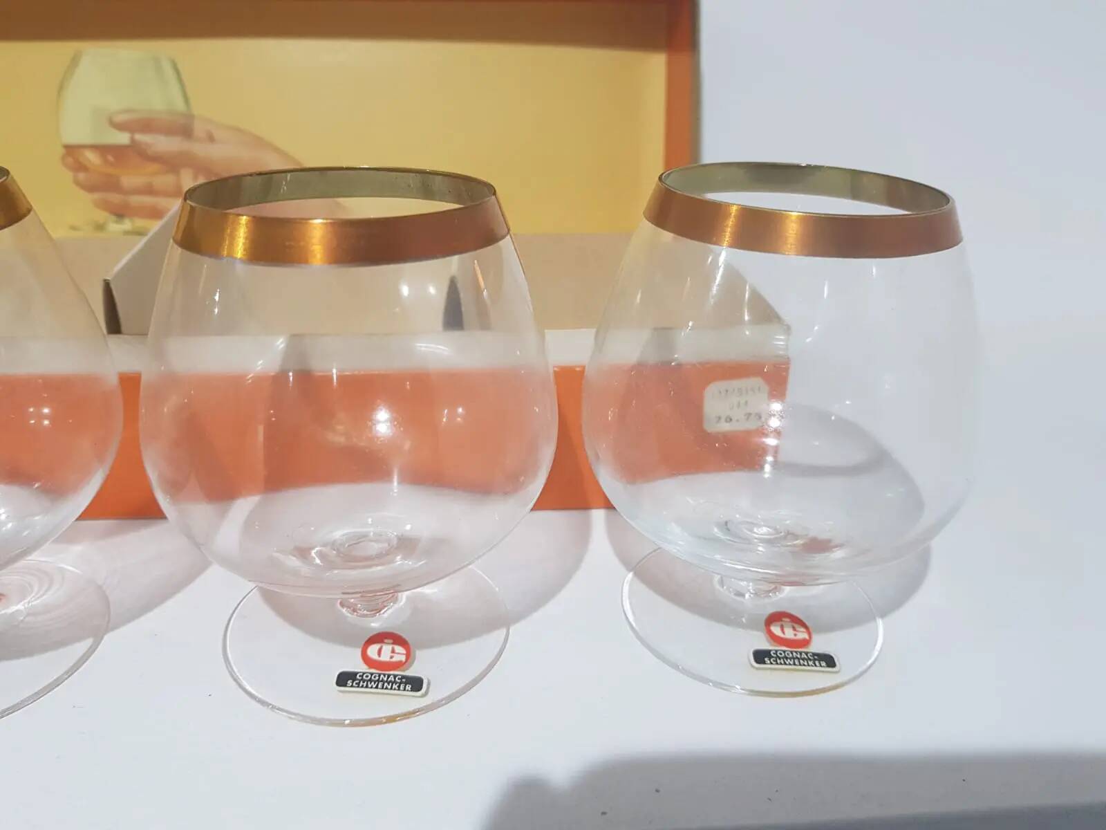 Set of six brandy glasses, transparent glass, gilding, Austria, 1960s.