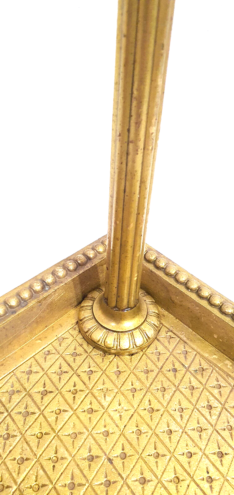 Old brass umbrella door triangular base mounted on column