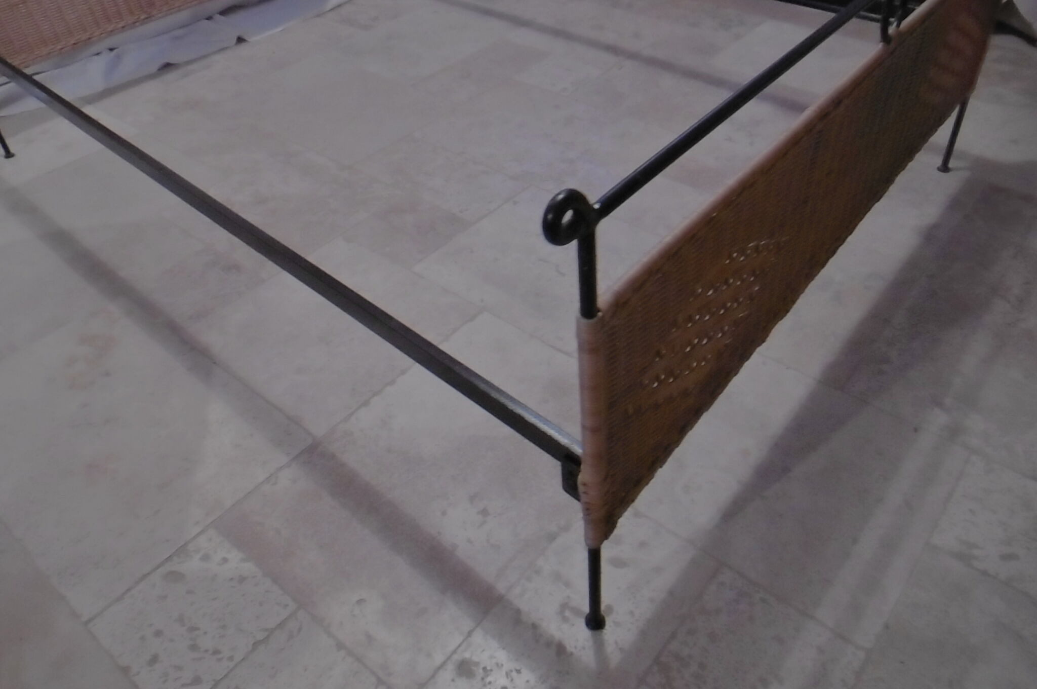 Black metal and rattan bed frame