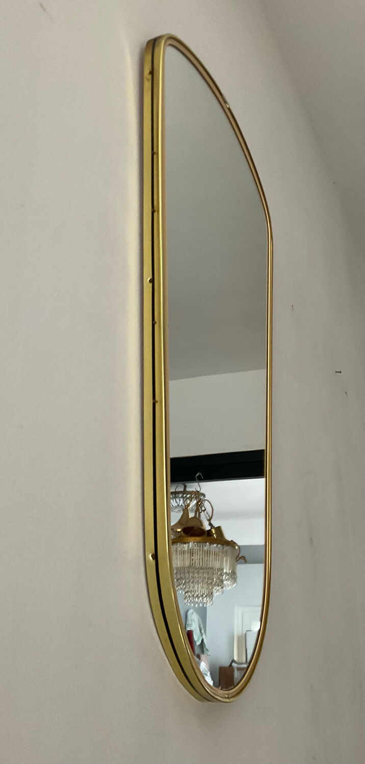 Asymmetrical free-form mirror from the 70s